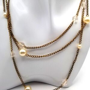 Delicate floating pearl triple strand necklace. N108
